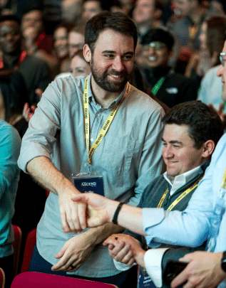 Two people shaking hands to show employee engagement