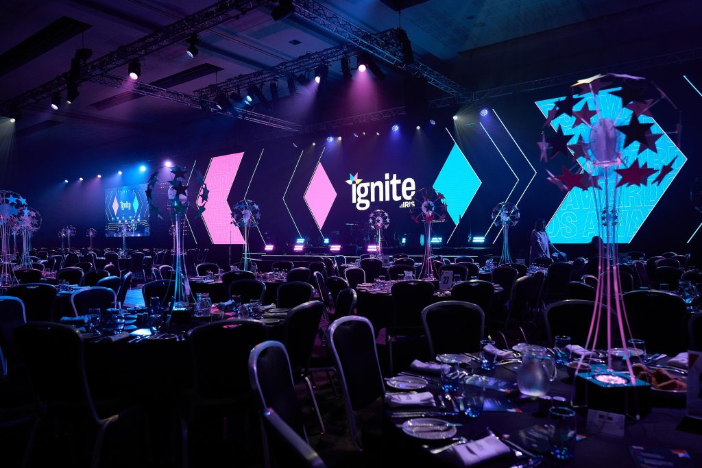 IRIS Ignite, wide main room shot, large LED Screen, large stage set